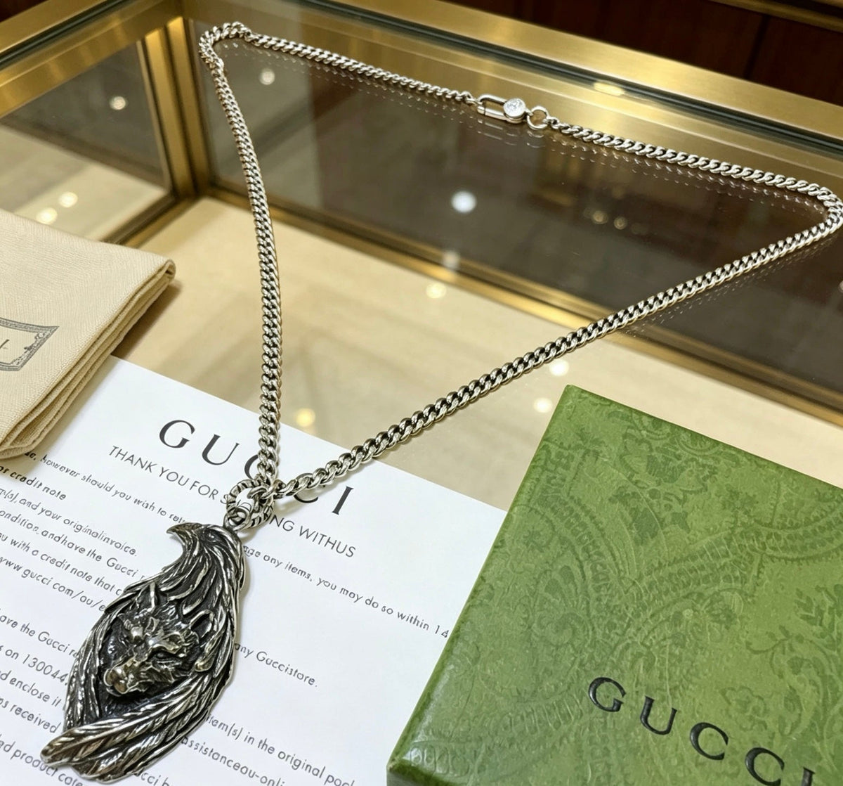 Martin Graham pendant necklace in polished metal-tone – close-up detail