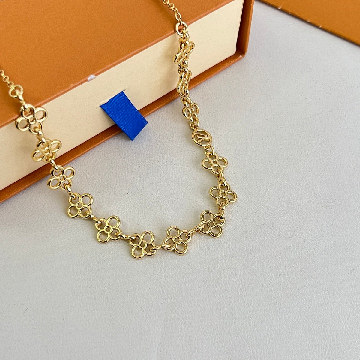 Martin Graham pendant necklace in polished metal-tone – side detail
