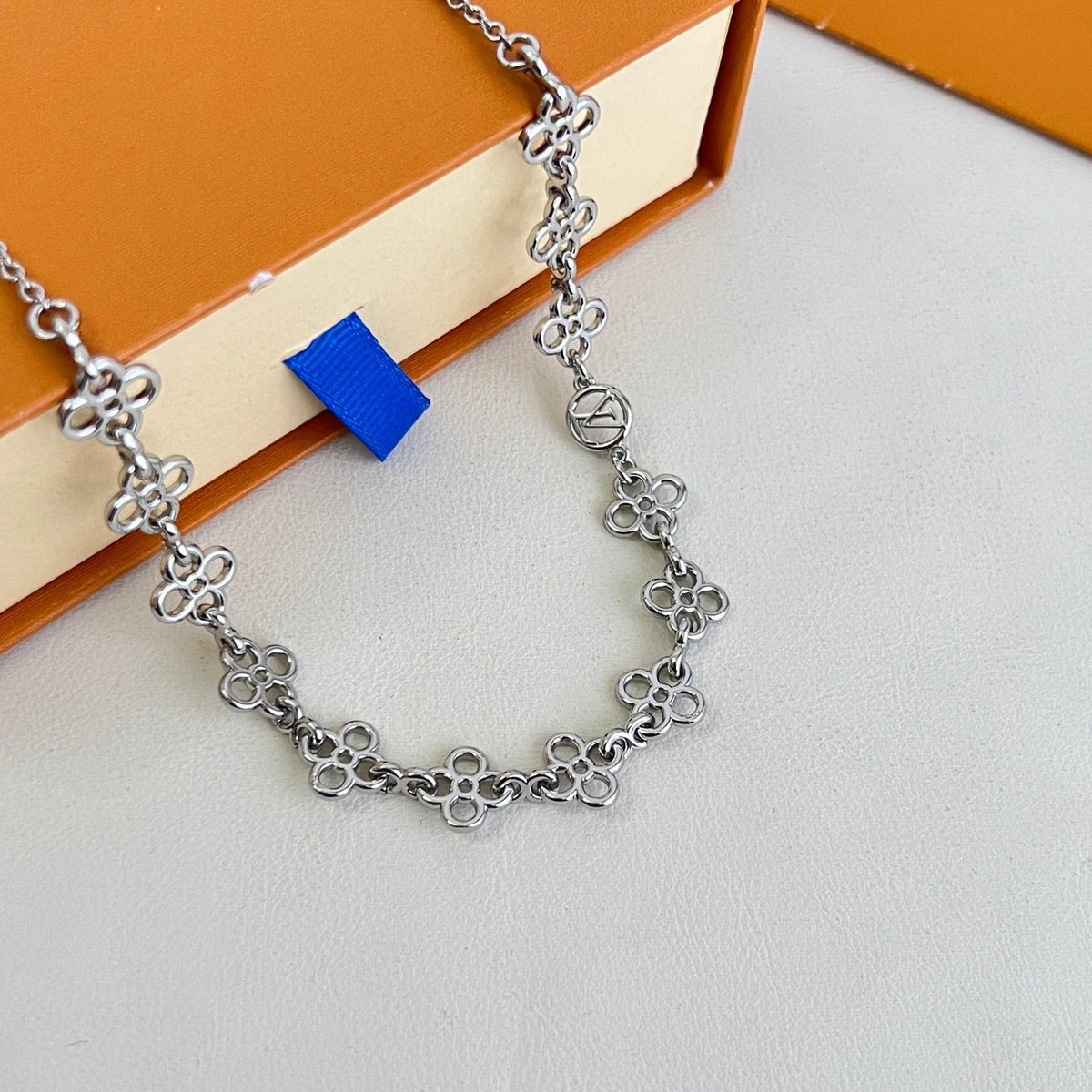Martin Graham pendant necklace in polished metal-tone – side detail
