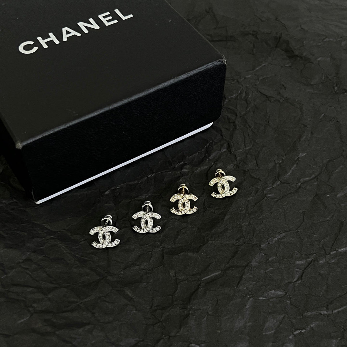 Martin Graham stud earrings in polished metal-tone – detail view