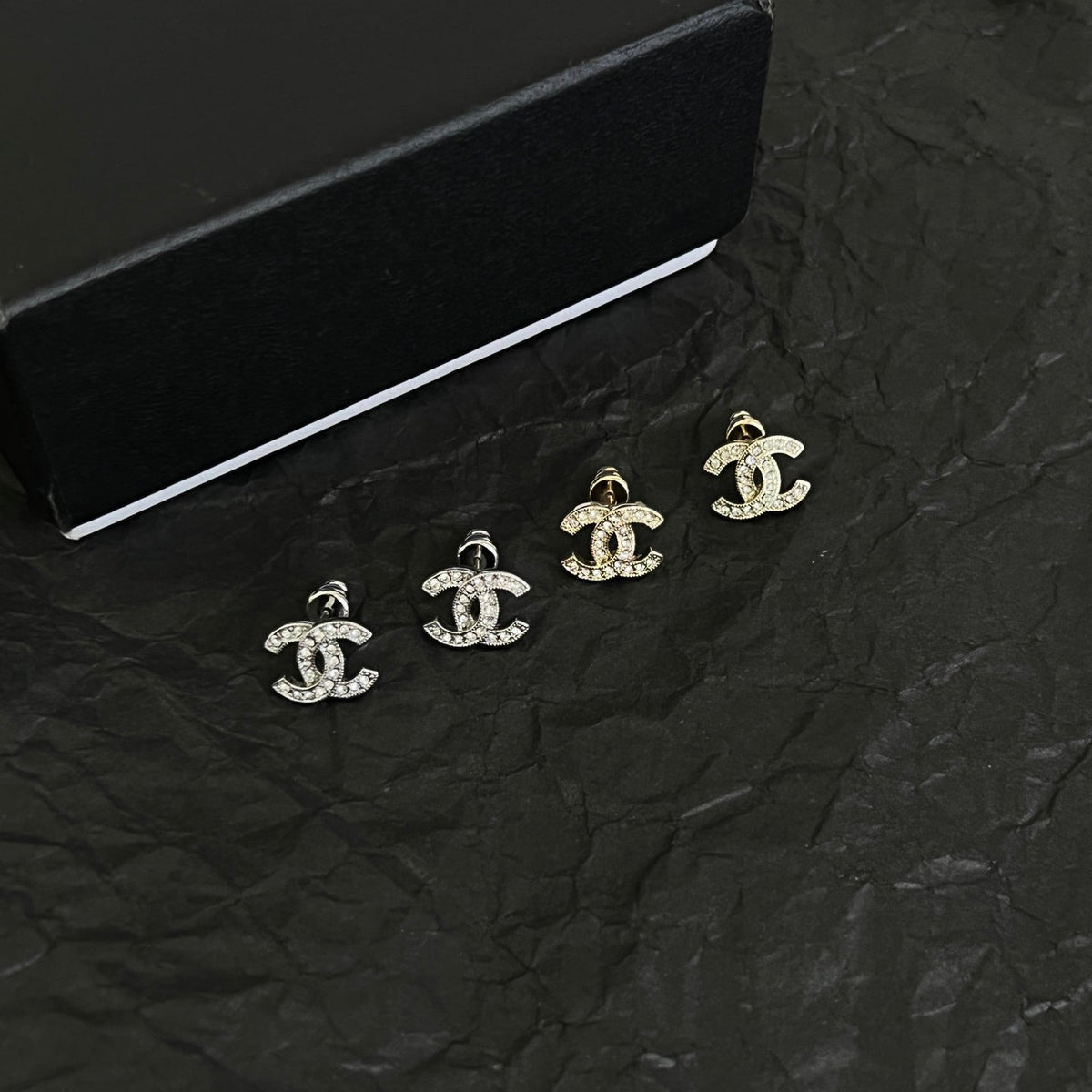 Martin Graham stud earrings in polished metal-tone – front product view