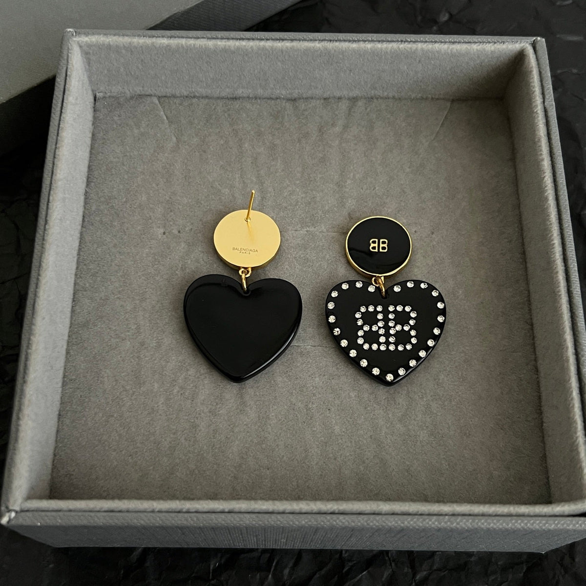 Martin Graham earrings in polished metal-tone – close-up detail
