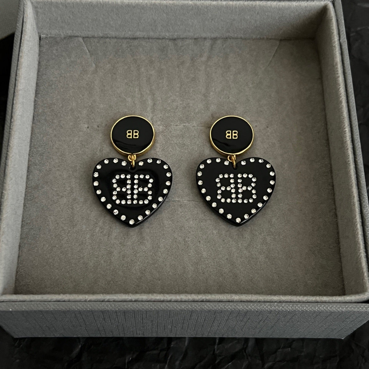 Martin Graham earrings in polished metal-tone – front product view