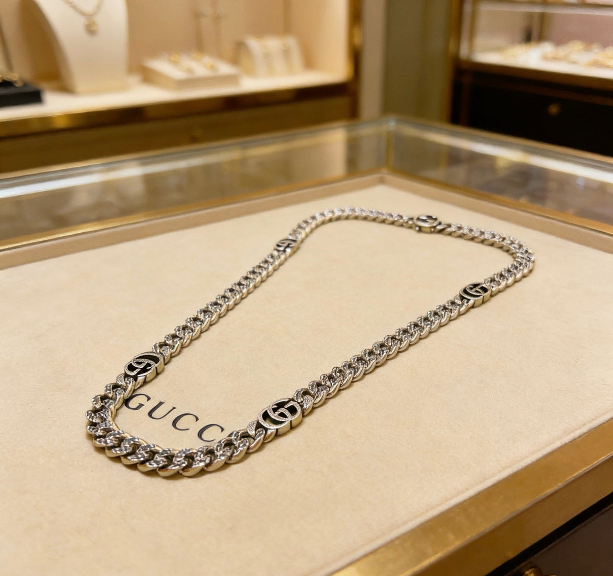 Martin Graham pendant necklace in polished metal-tone – close-up detail