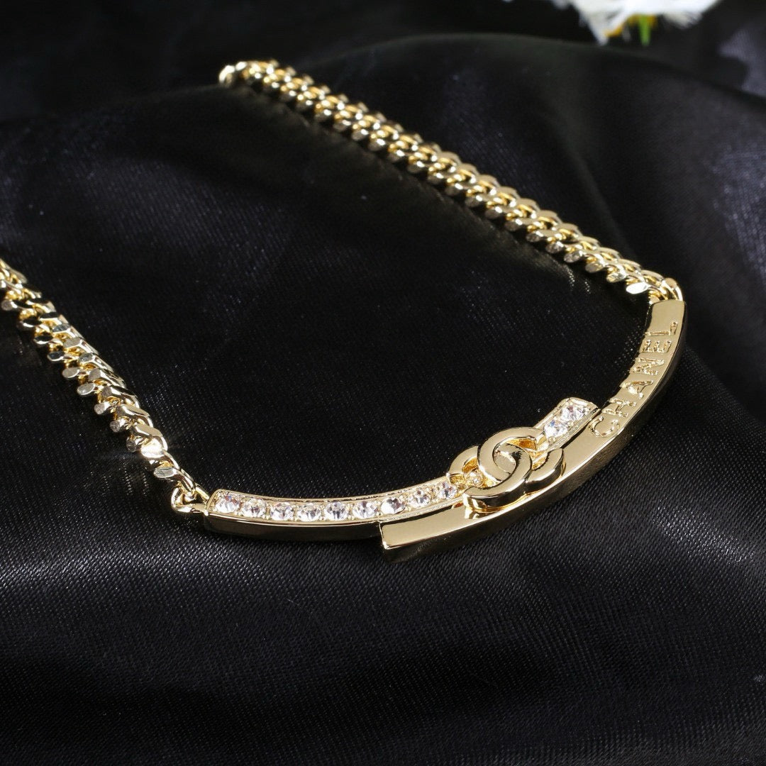 Martin Graham pendant necklace in polished metal-tone – close-up detail
