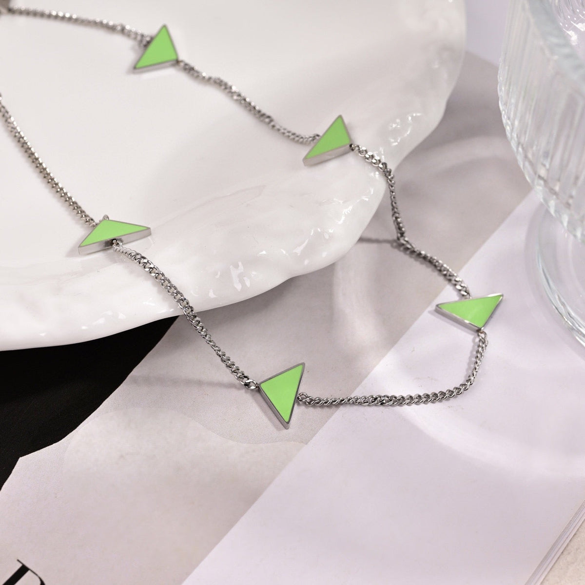 Martin Graham pendant necklace in polished metal-tone – side detail