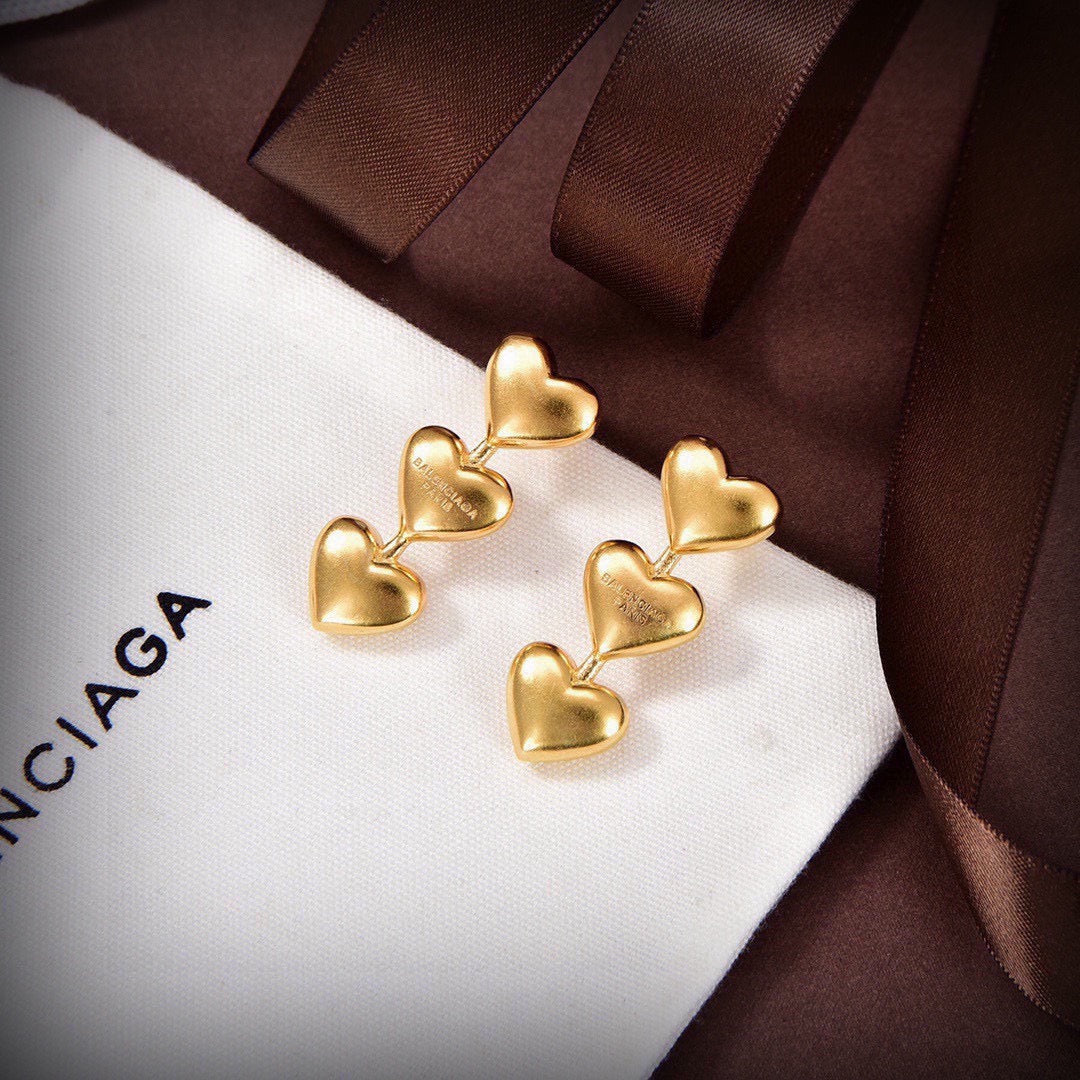 Martin Graham stud earrings in polished metal-tone – front product view