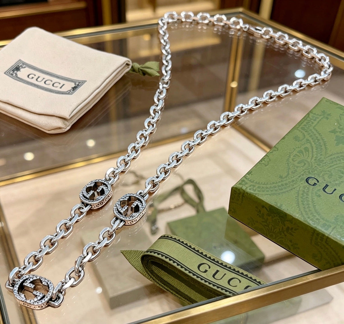 Martin Graham pendant necklace in polished metal-tone – detail view