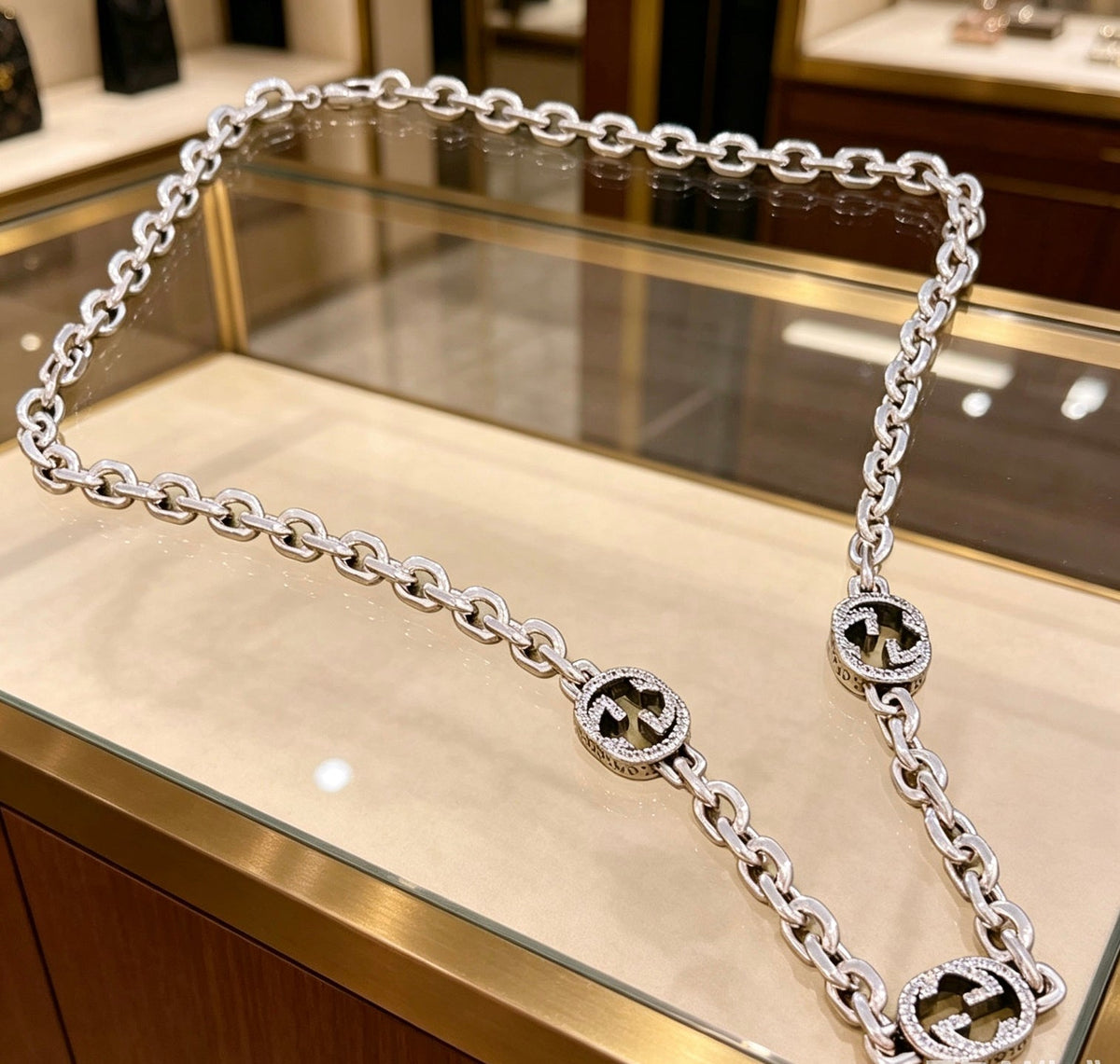 Martin Graham pendant necklace in polished metal-tone – side detail