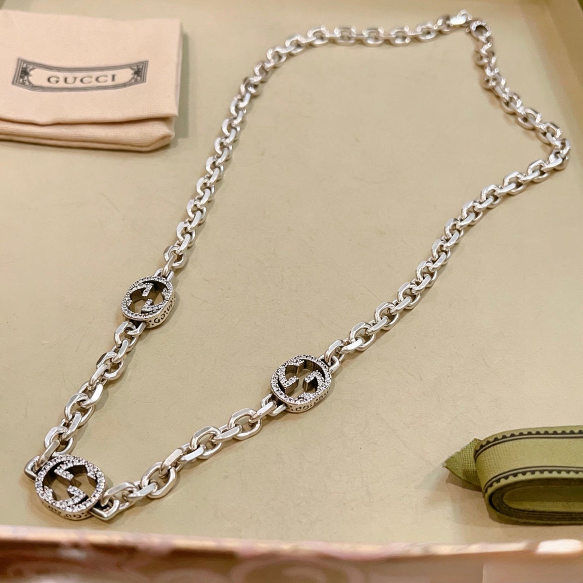 Martin Graham pendant necklace in polished metal-tone – detail view