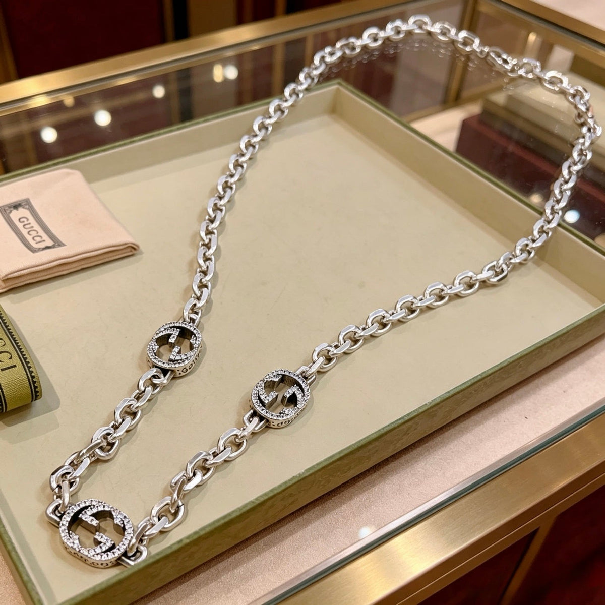Martin Graham pendant necklace in polished metal-tone – close-up detail