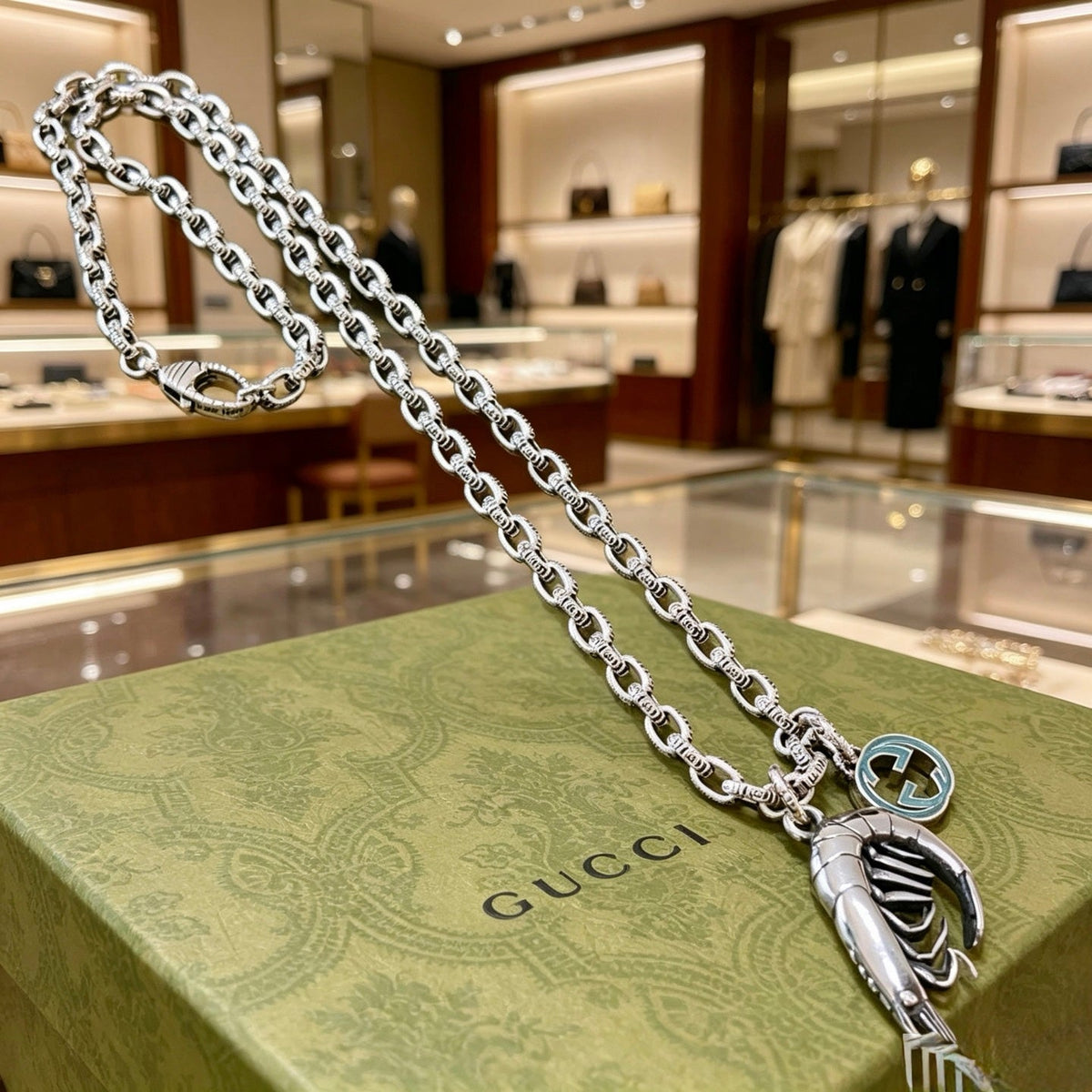 Martin Graham pendant necklace in polished metal-tone – close-up detail