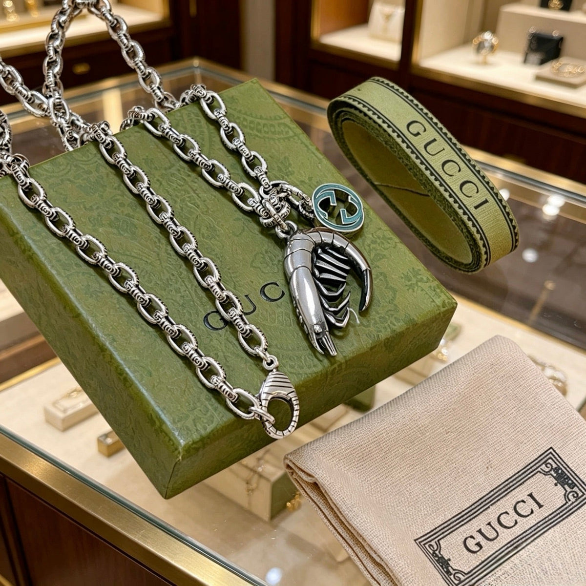 Martin Graham pendant necklace in polished metal-tone – side detail