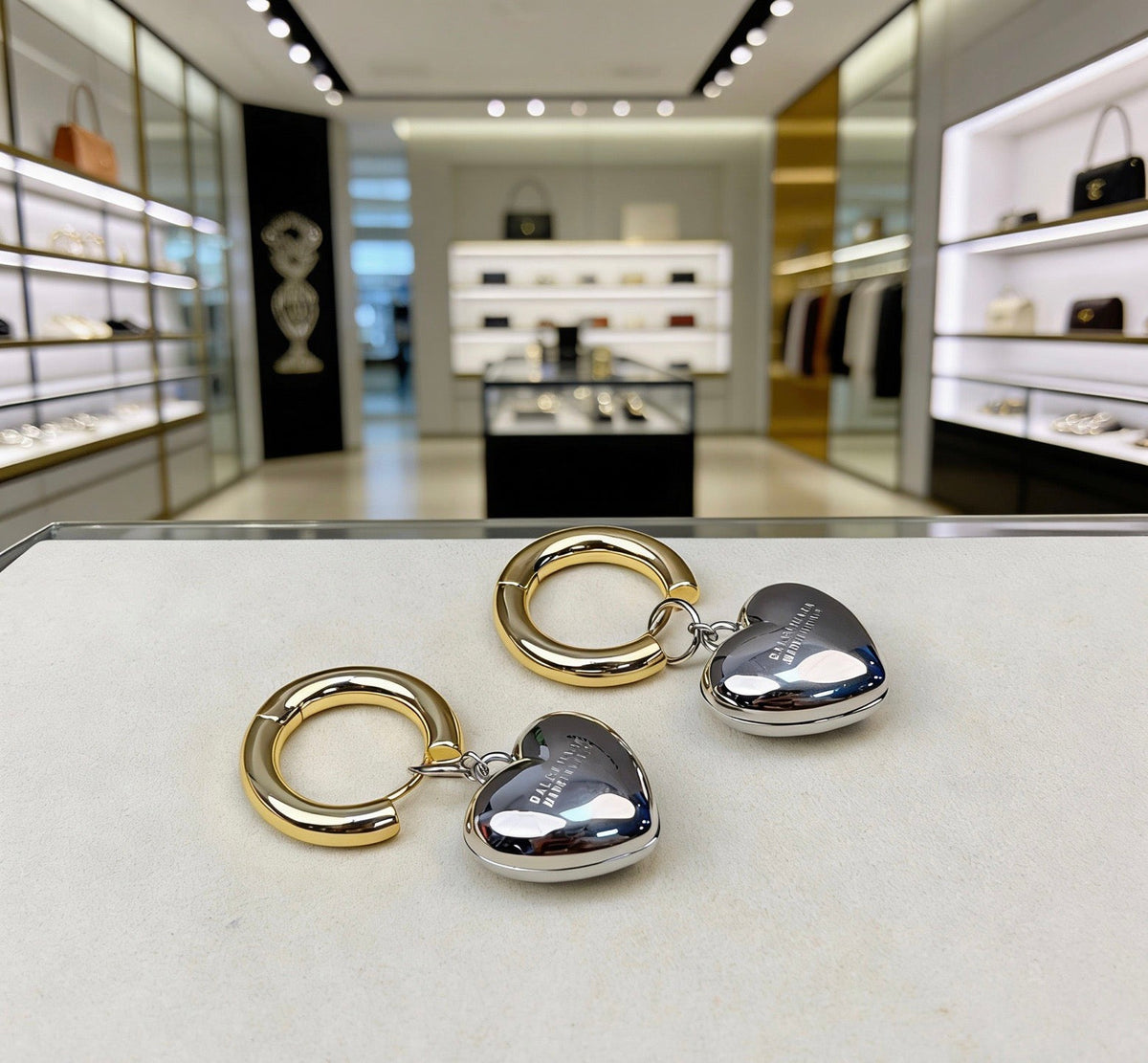 Martin Graham stud earrings in polished metal-tone – styled product view