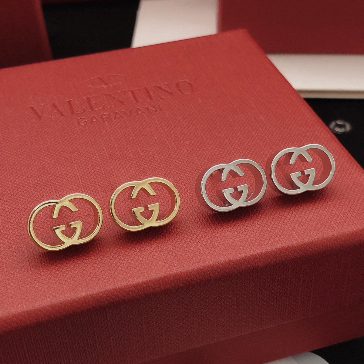 Martin Graham stud earrings in polished metal-tone – front product view