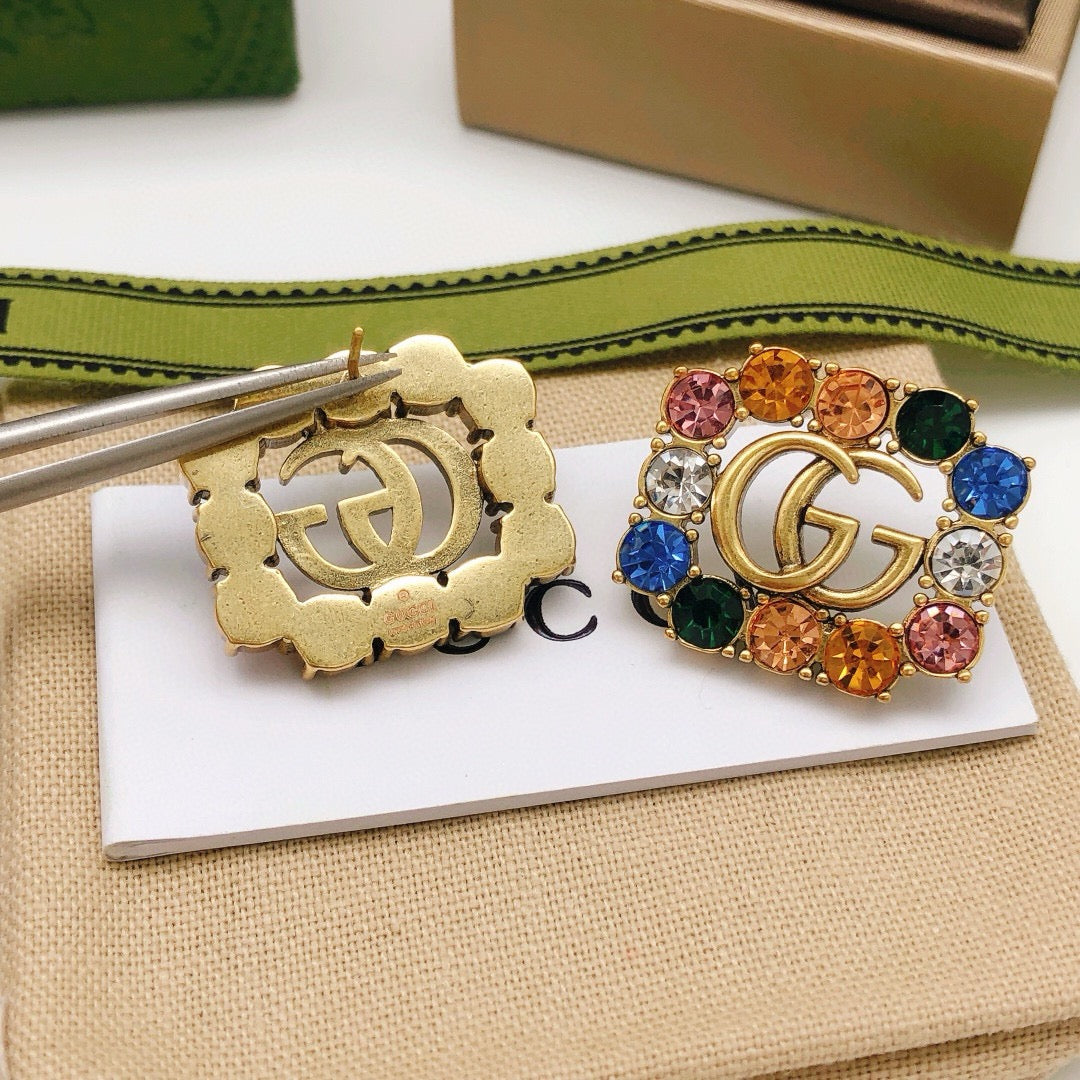 Martin Graham stud earrings in polished metal-tone – detail view