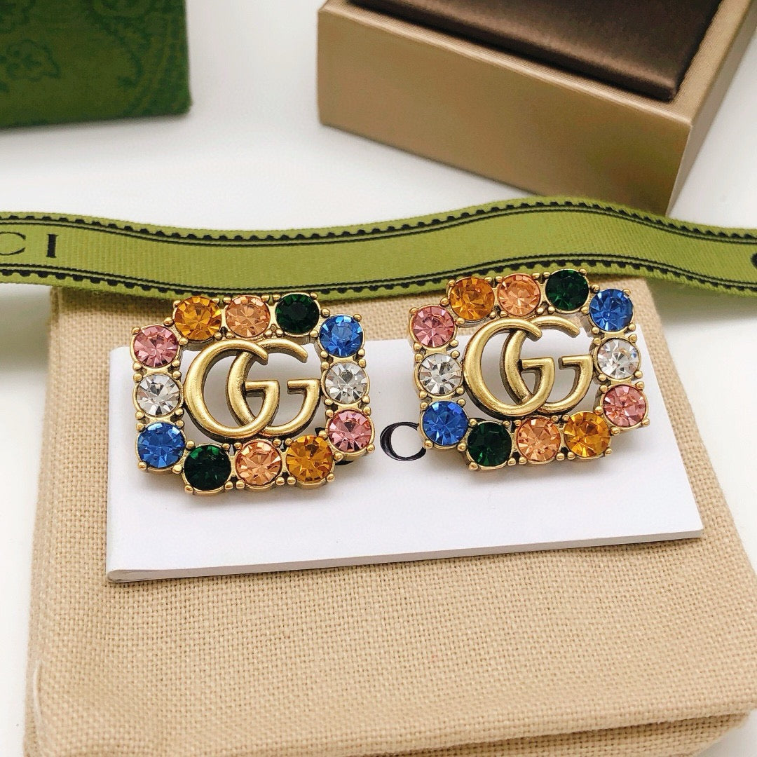 Martin Graham stud earrings in polished metal-tone – front product view