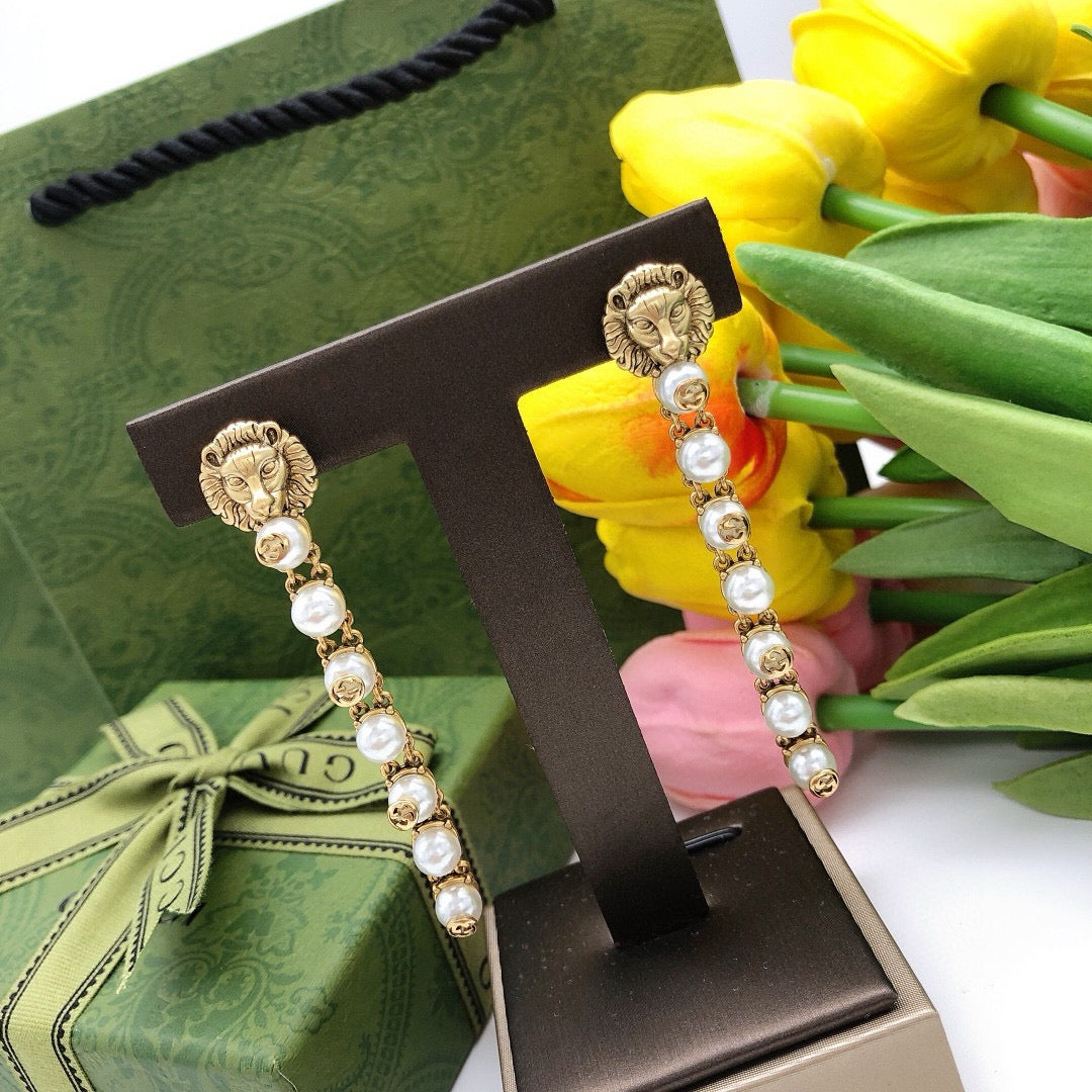Martin Graham stud earrings in polished metal-tone – side detail
