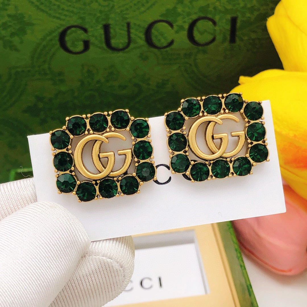 Martin Graham stud earrings in polished metal-tone – detail view