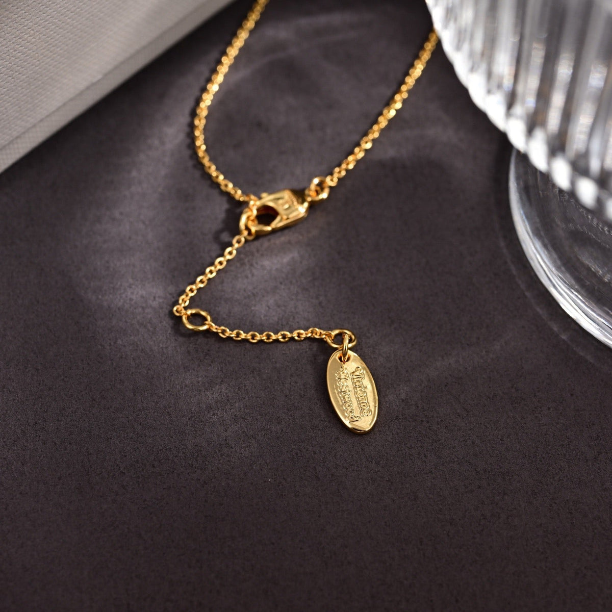Martin Graham pendant necklace in polished metal-tone – side detail