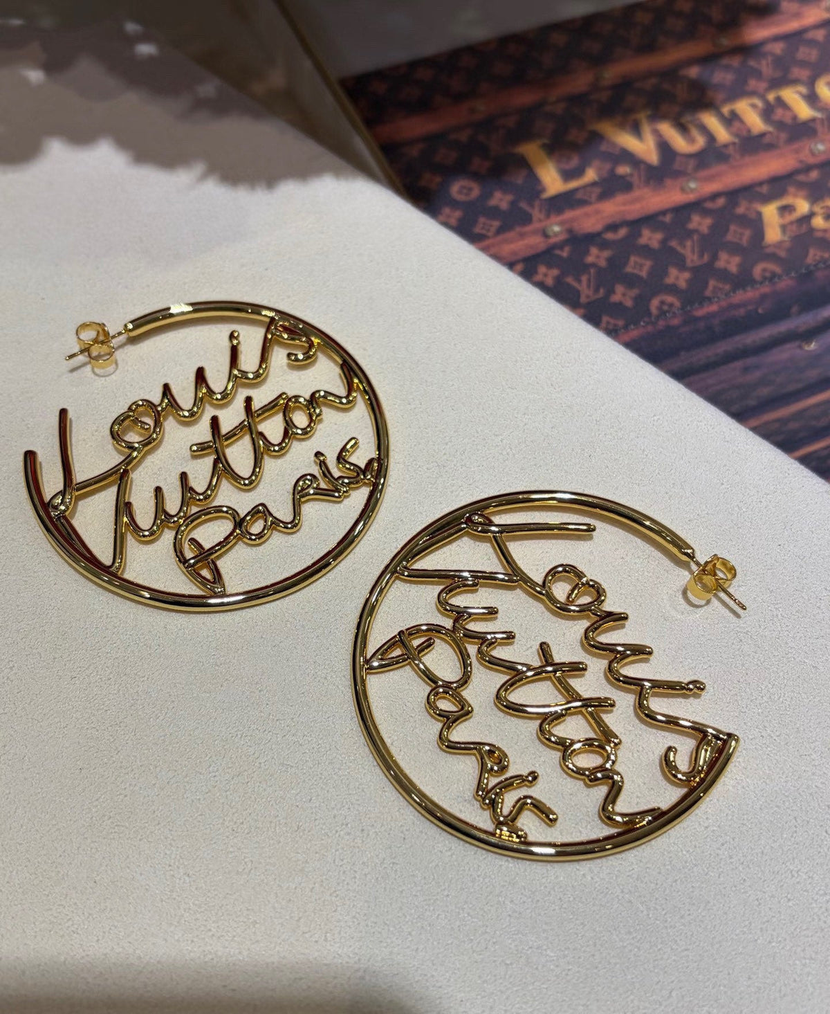 Martin Graham stud earrings in polished metal-tone – detail view