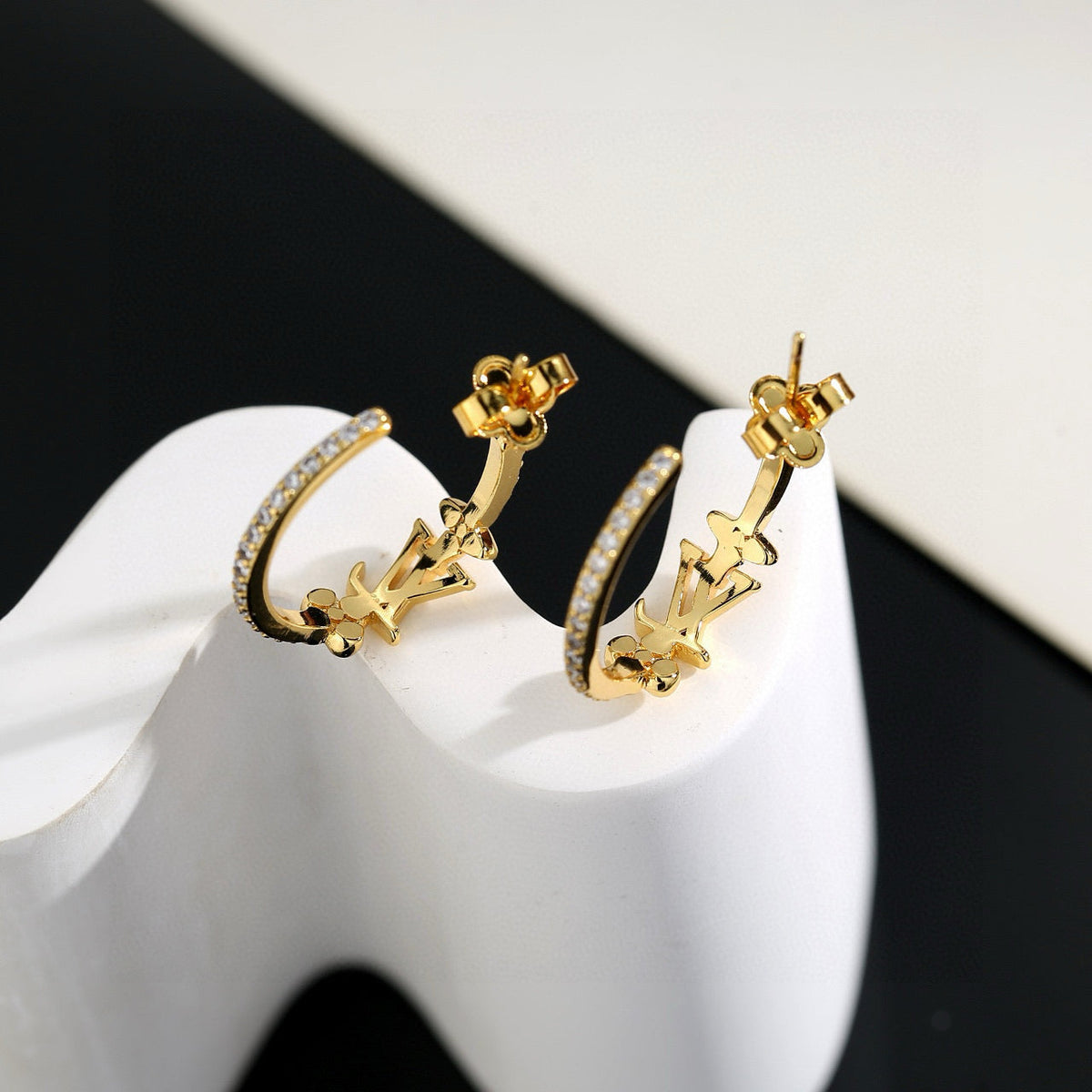 Martin Graham stud earrings in polished metal-tone – side detail