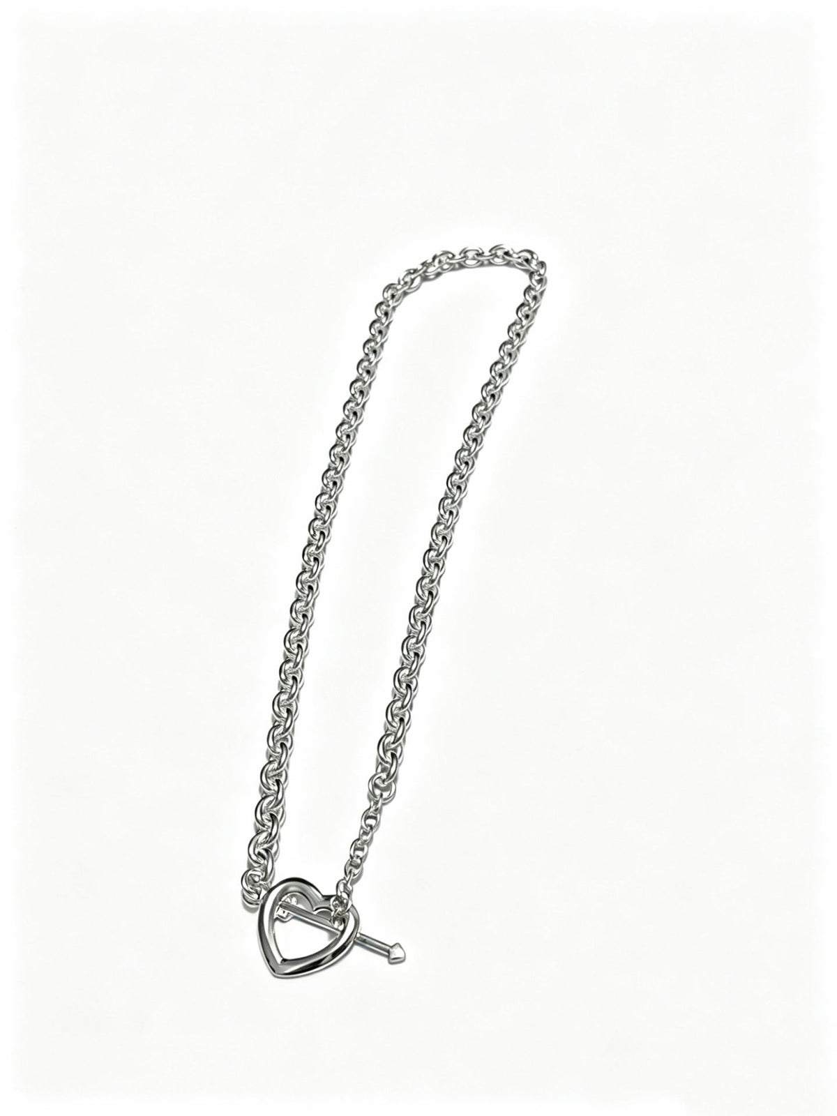 Martin Graham pendant necklace in polished metal-tone – side detail
