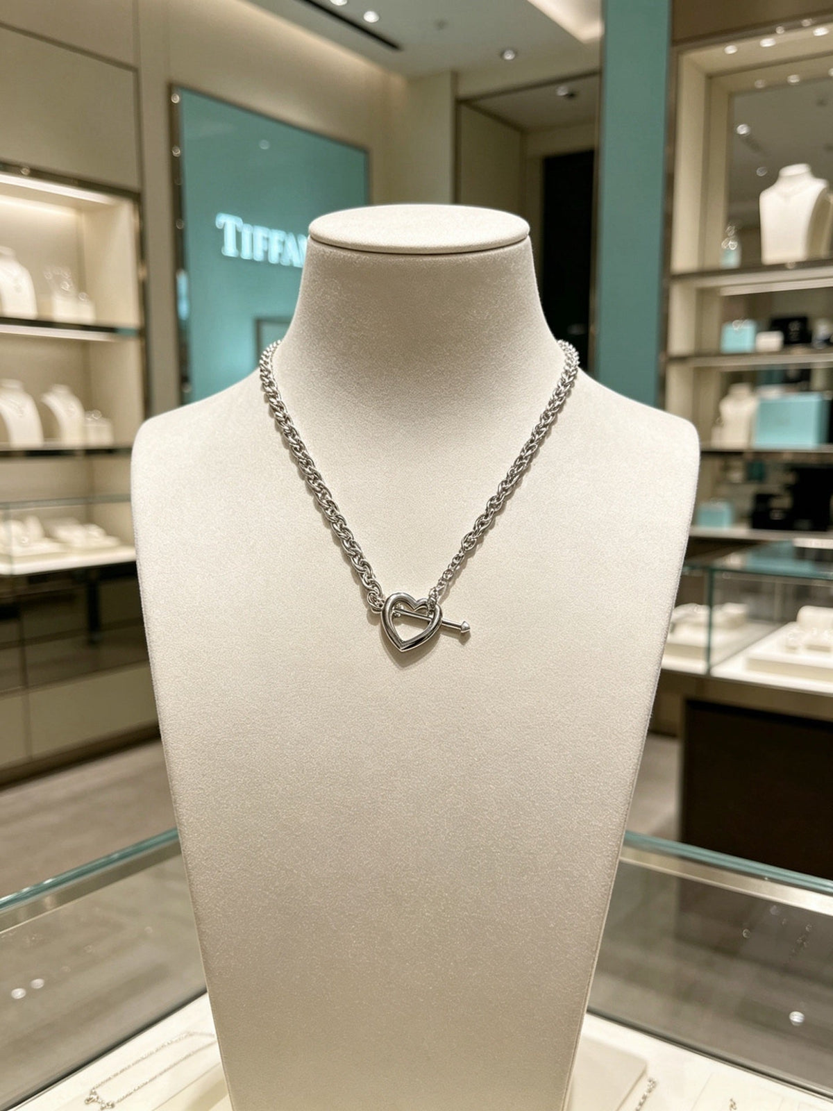 Martin Graham pendant necklace in polished metal-tone – side detail