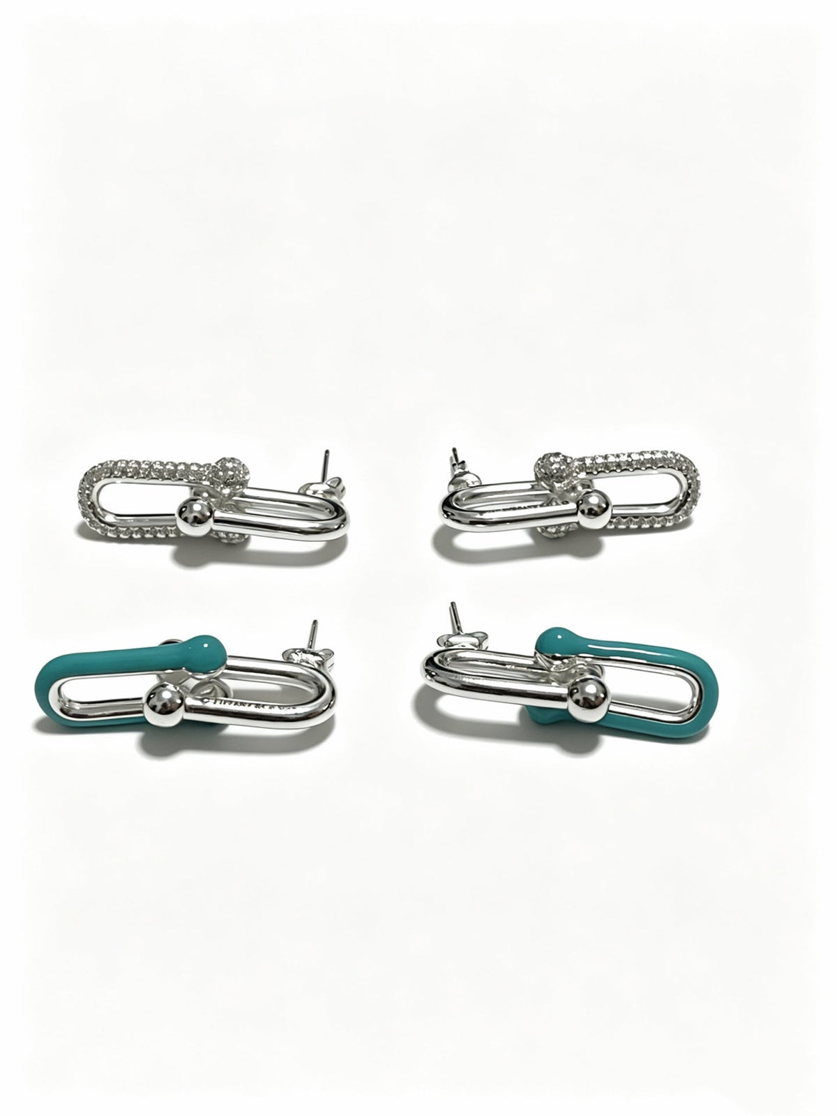 Martin Graham stud earrings in polished metal-tone – side detail