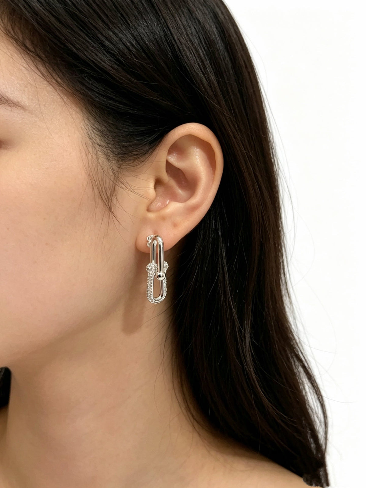 Martin Graham stud earrings in polished metal-tone – front product view