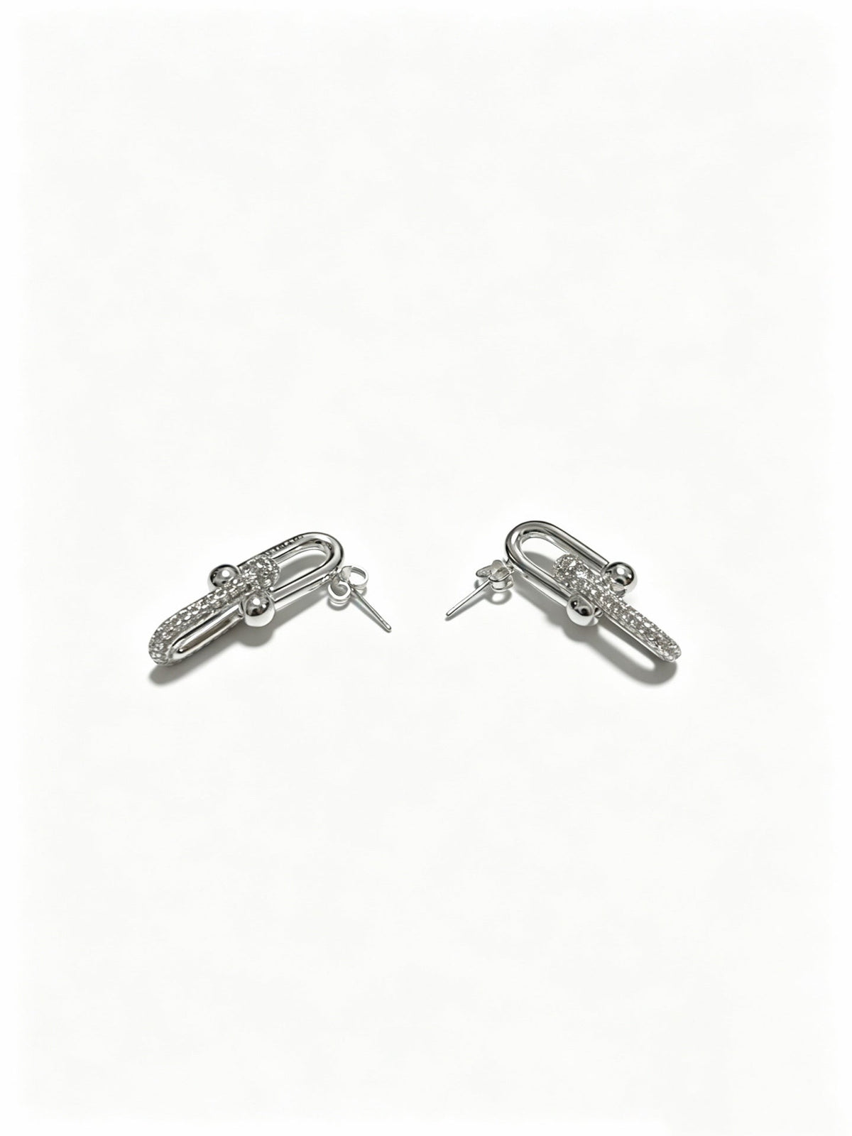 Martin Graham stud earrings in polished metal-tone – front product view