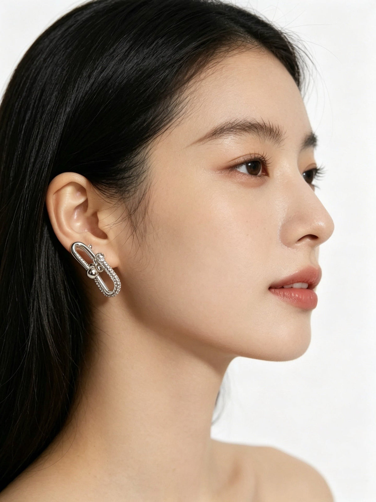 Martin Graham stud earrings in polished metal-tone – main product view