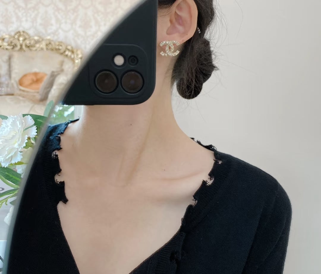 Martin Graham stud earrings in polished metal-tone – styled product view