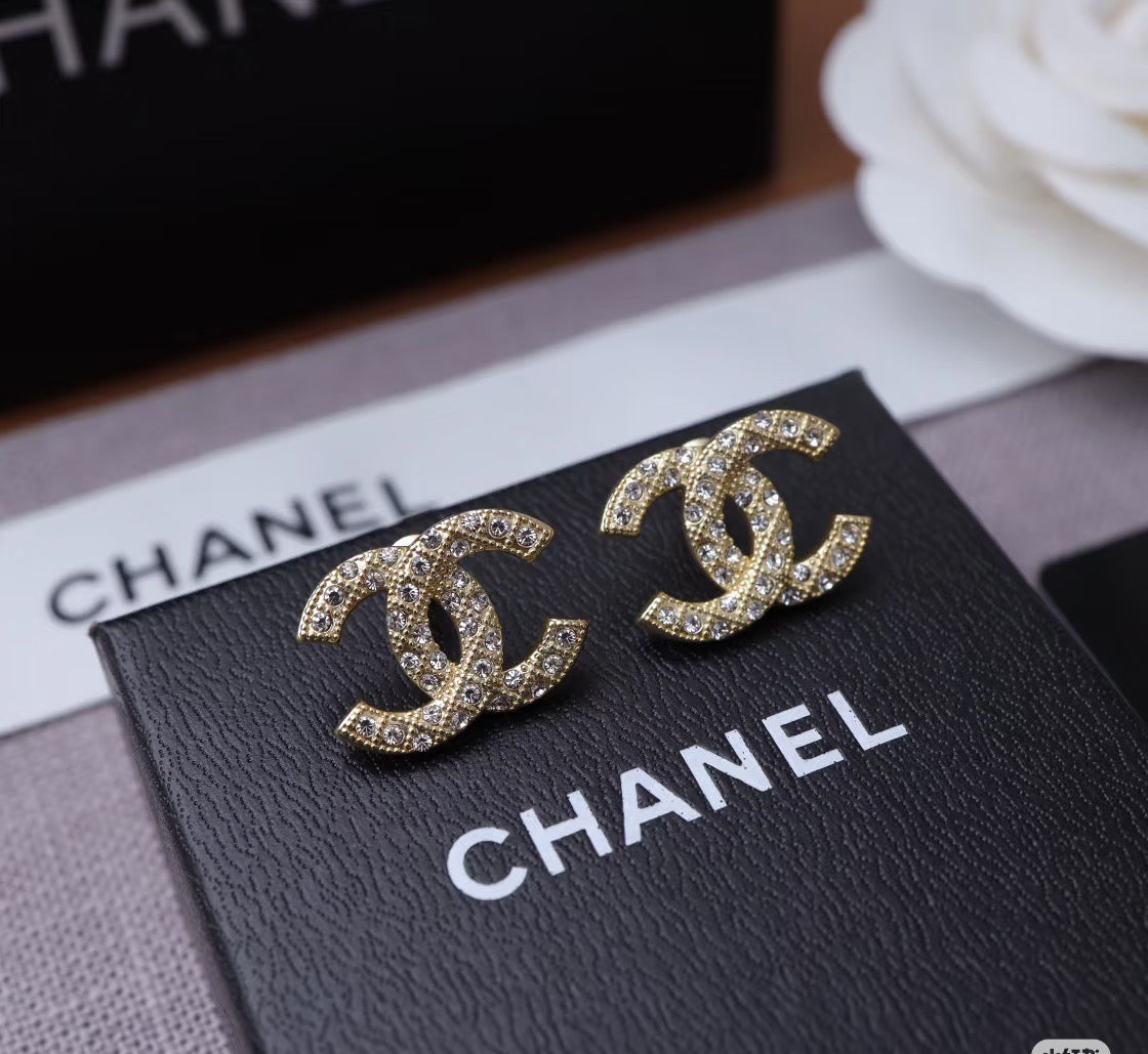 Martin Graham stud earrings in polished metal-tone – detail view