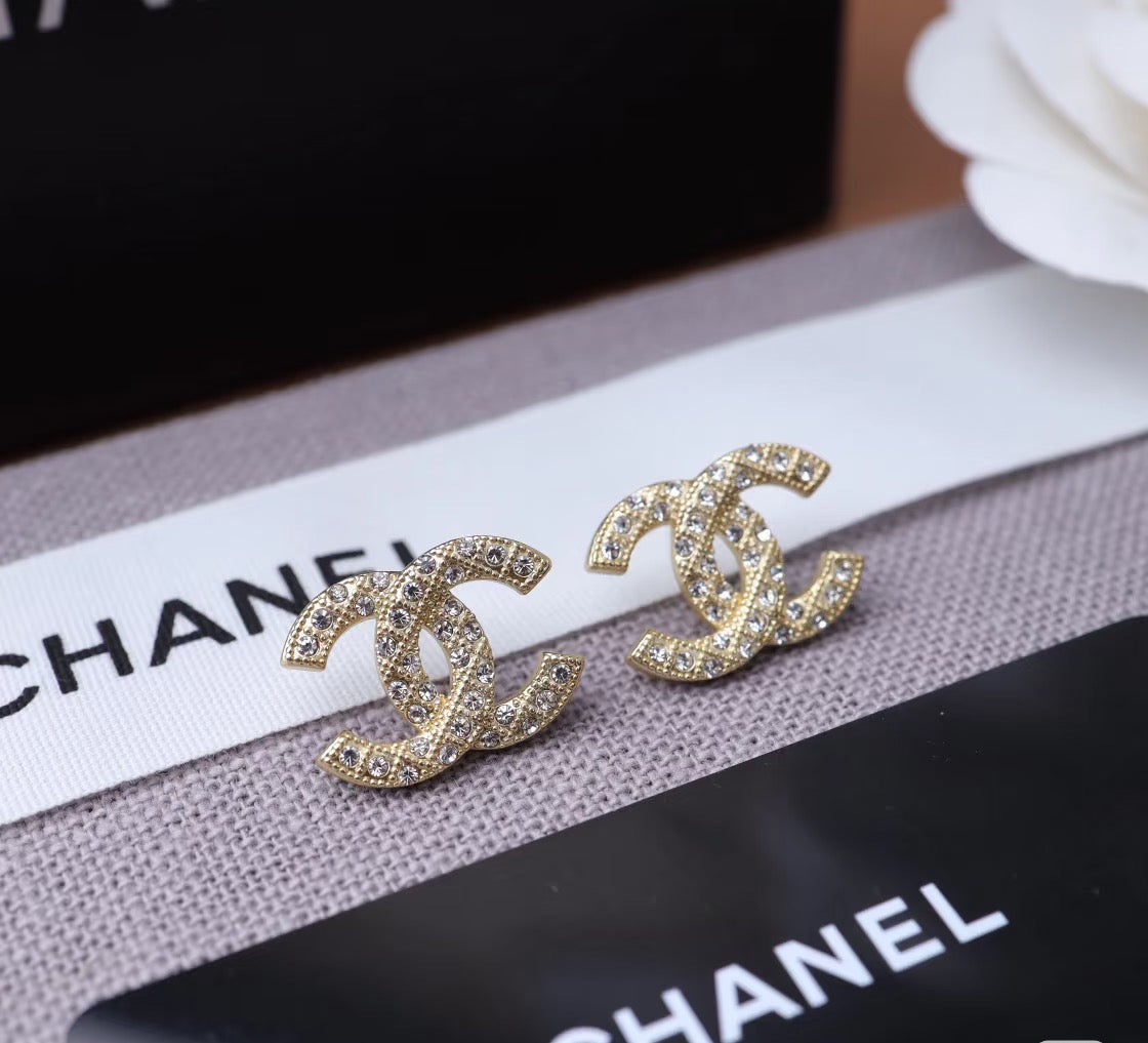 Martin Graham stud earrings in polished metal-tone – side detail
