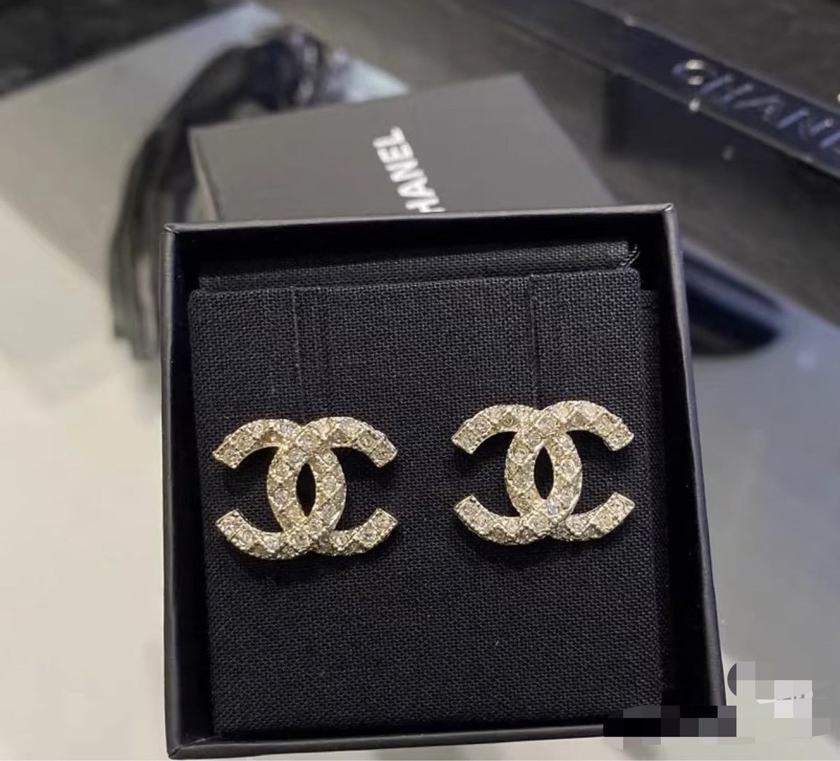 Martin Graham stud earrings in polished metal-tone – front product view