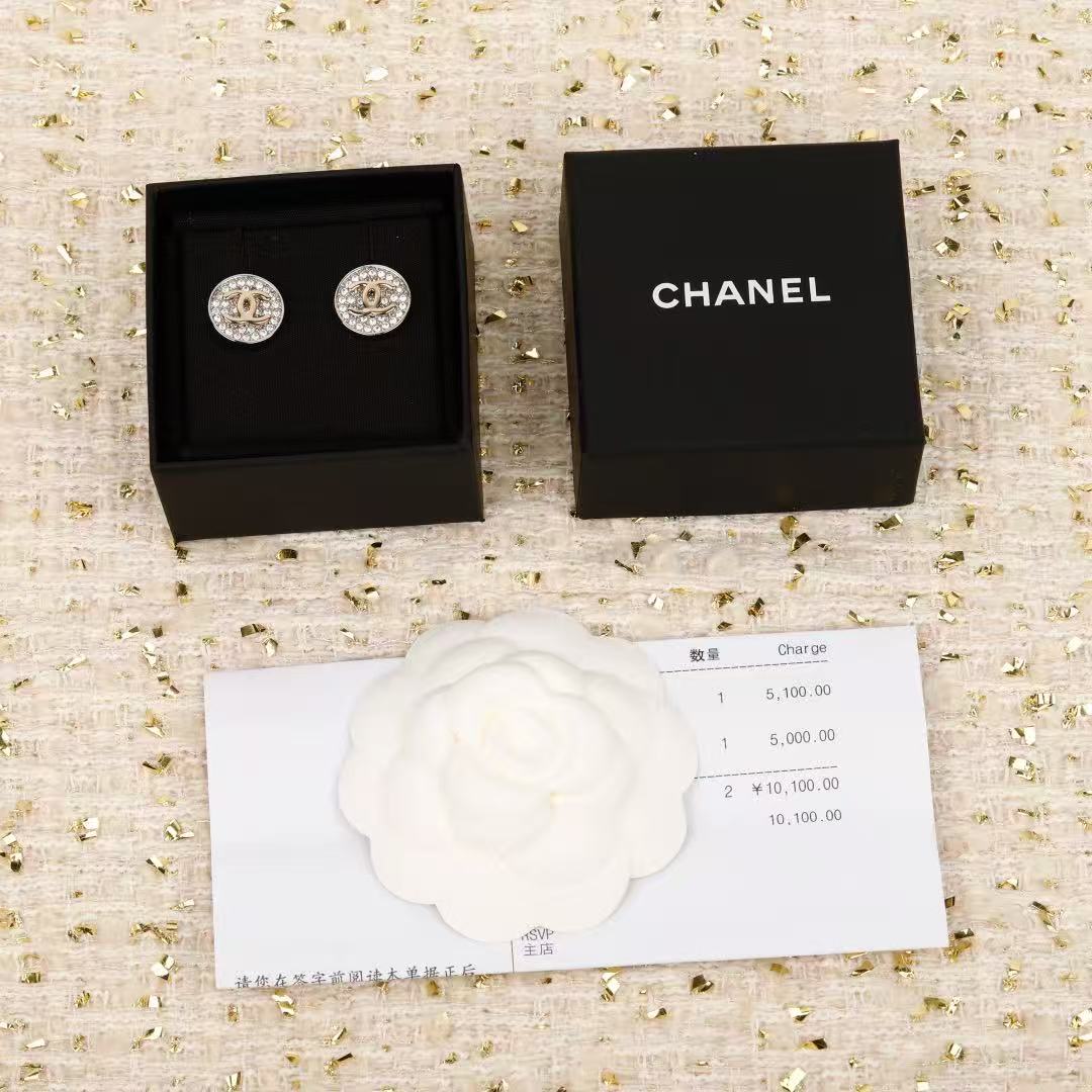 Martin Graham stud earrings in polished metal-tone – close-up detail