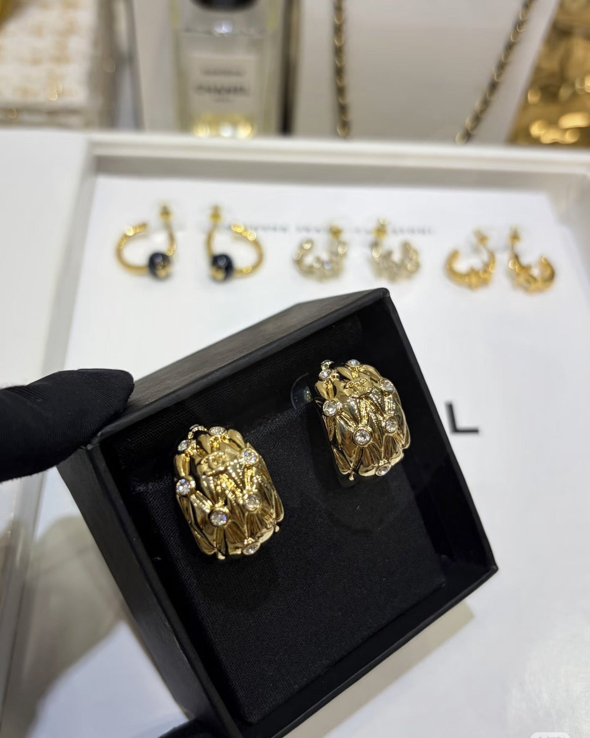 Martin Graham stud earrings in polished metal-tone – front product view