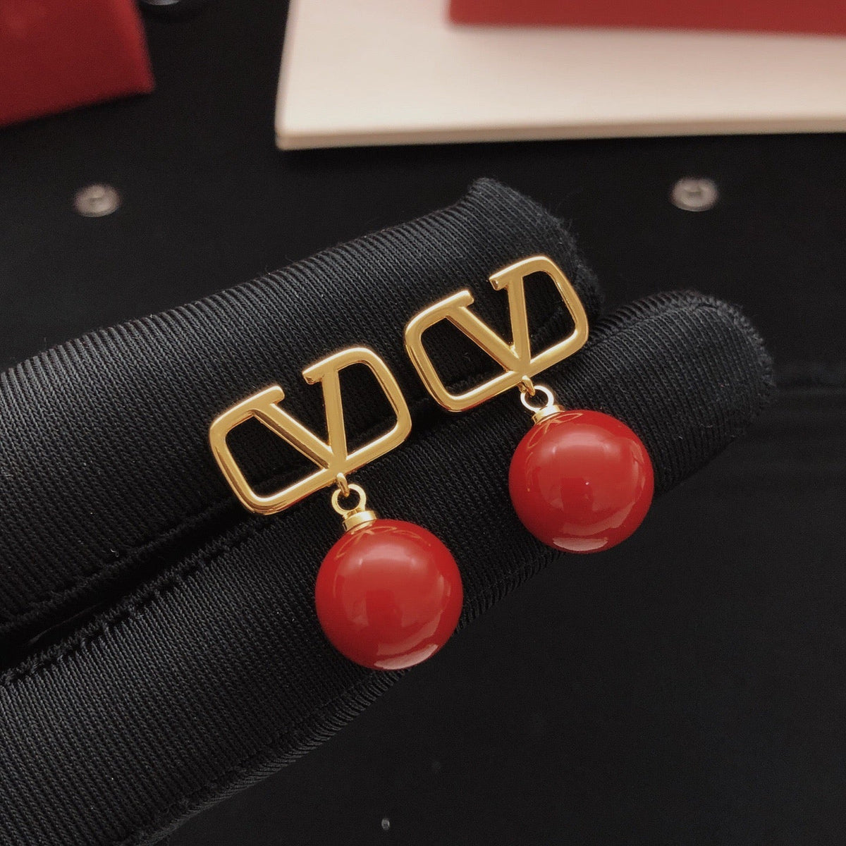 Martin Graham stud earrings in polished metal-tone – front view