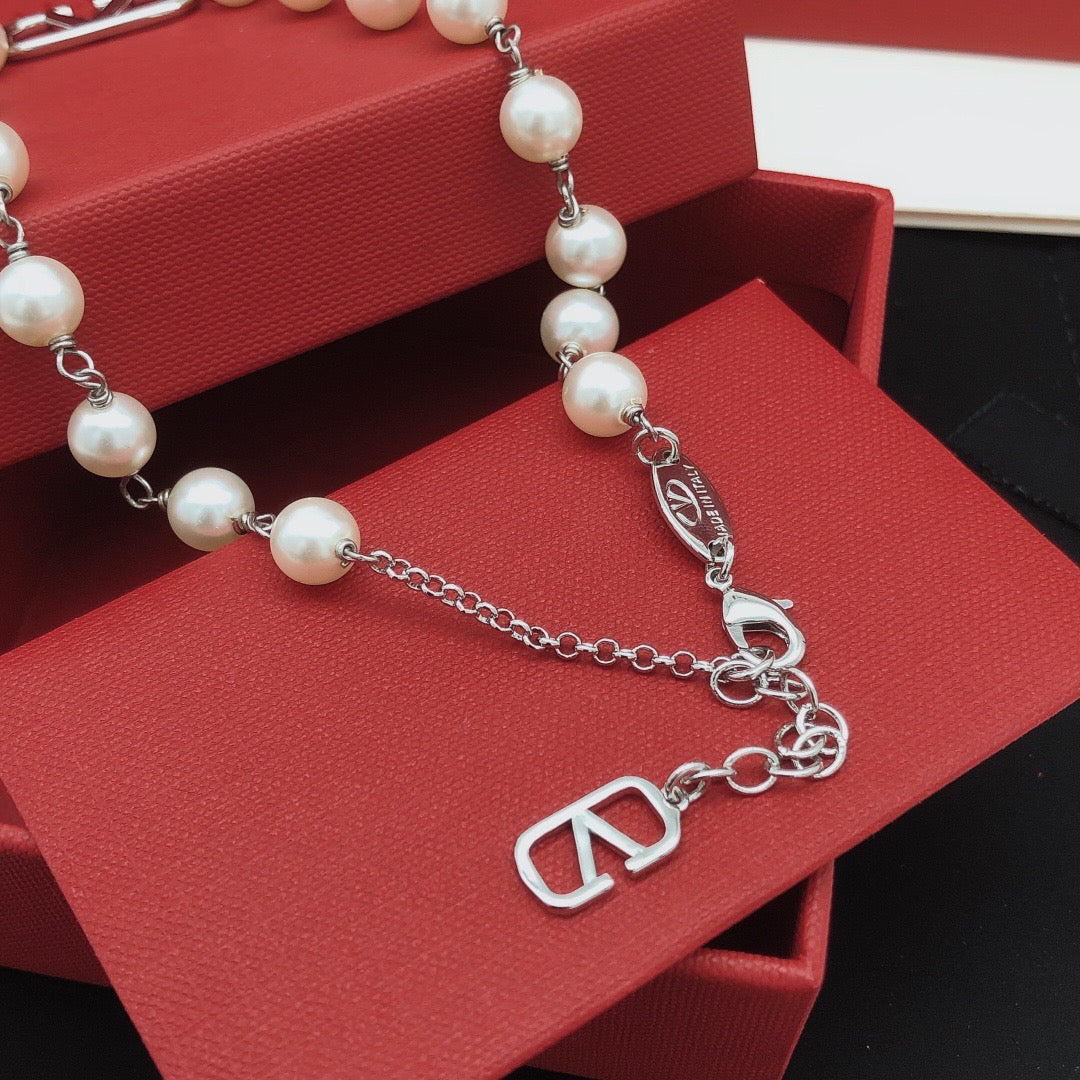Martin Graham pendant necklace in polished metal-tone – front view