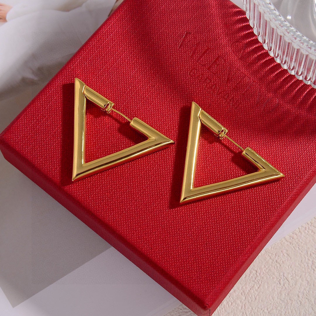 Martin Graham stud earrings in polished metal-tone – side detail
