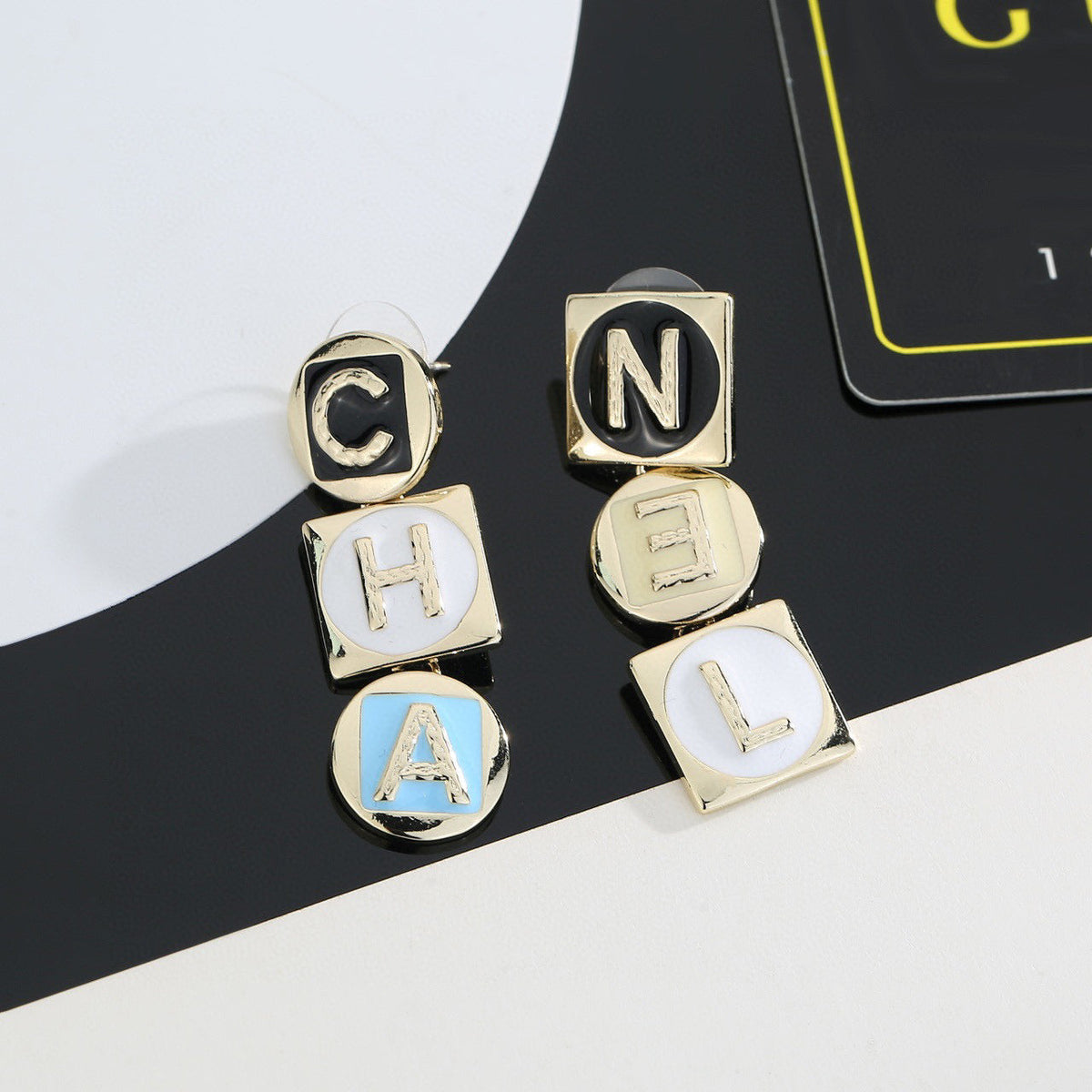 Martin Graham stud earrings in polished metal-tone – side detail