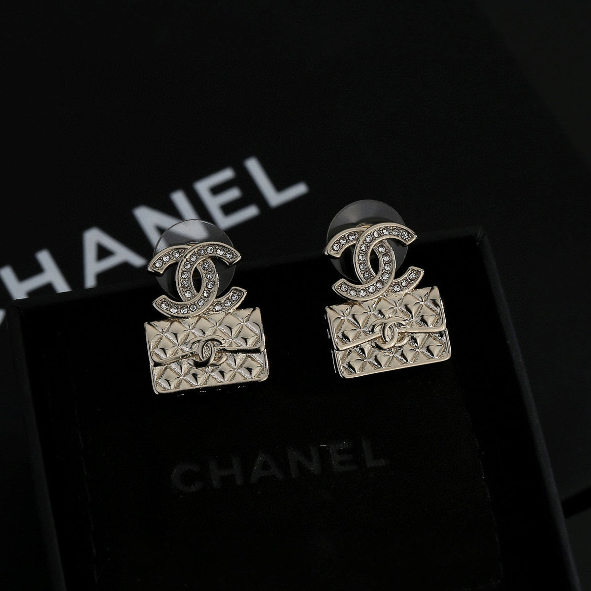 Martin Graham stud earrings in polished metal-tone – styled product view