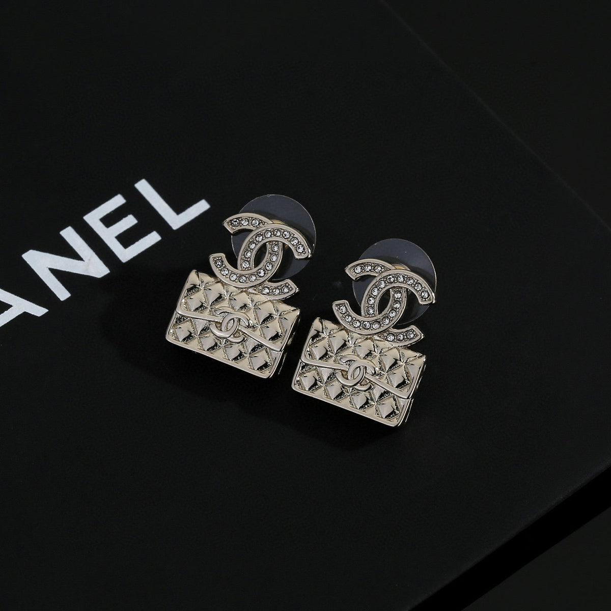 Martin Graham stud earrings in polished metal-tone – front product view