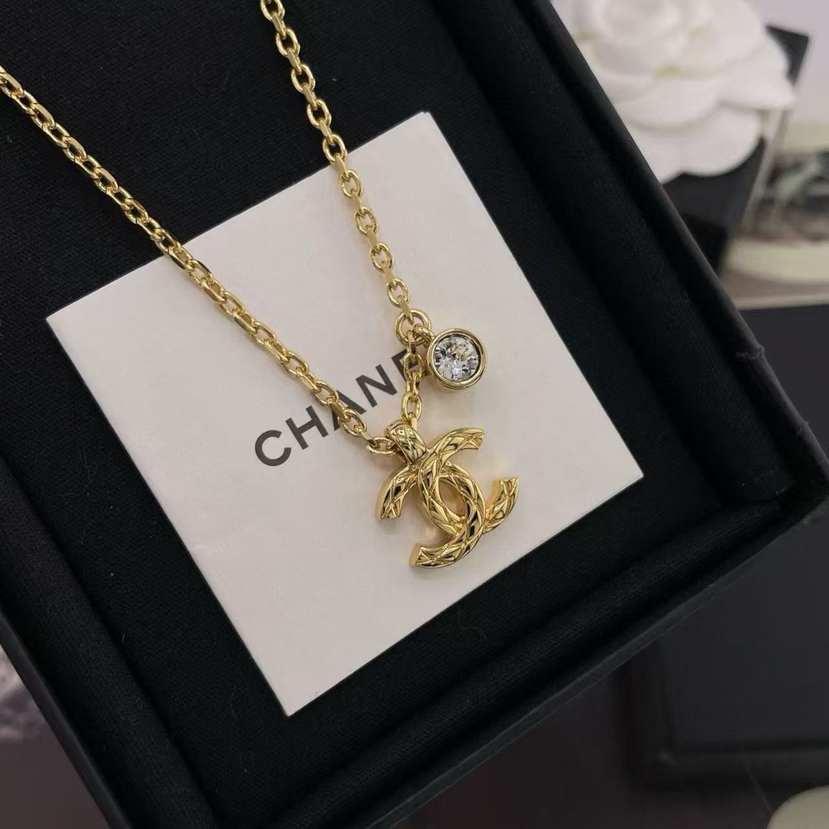 Martin Graham pendant necklace in polished metal-tone – close-up detail