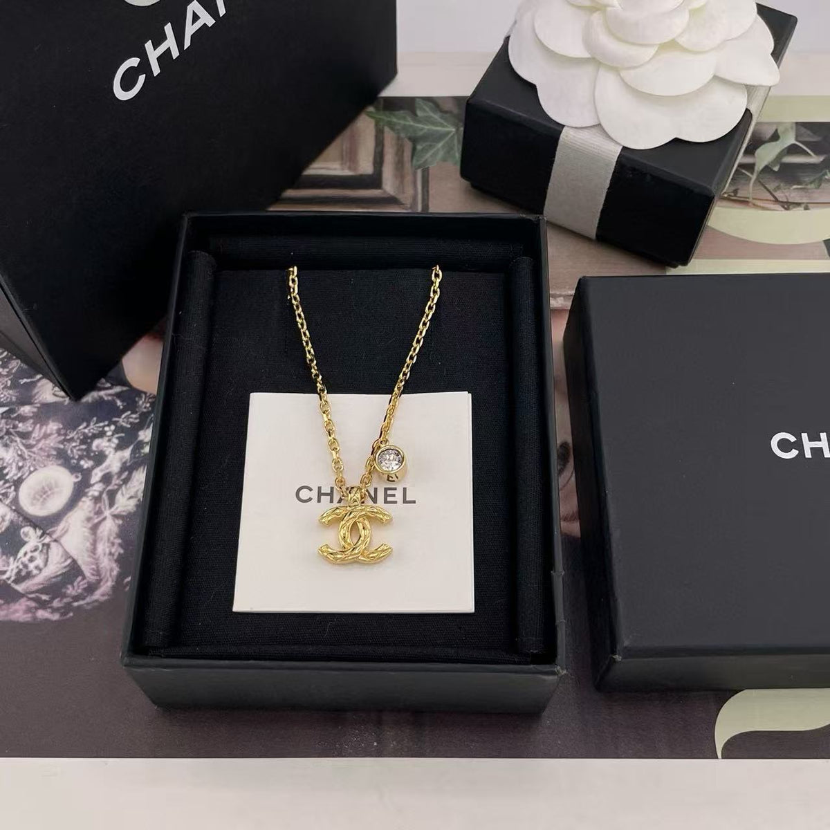 Martin Graham pendant necklace in polished metal-tone – side detail