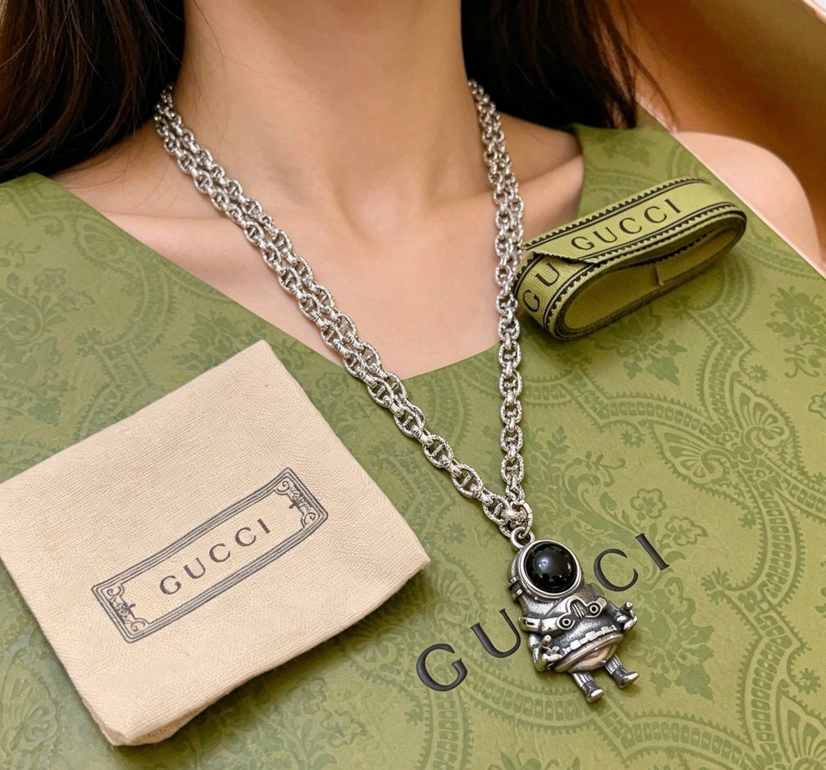 Martin Graham pendant necklace in polished metal-tone – detail view