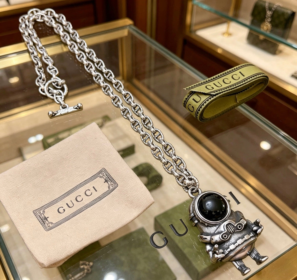 Martin Graham pendant necklace in polished metal-tone – detail view