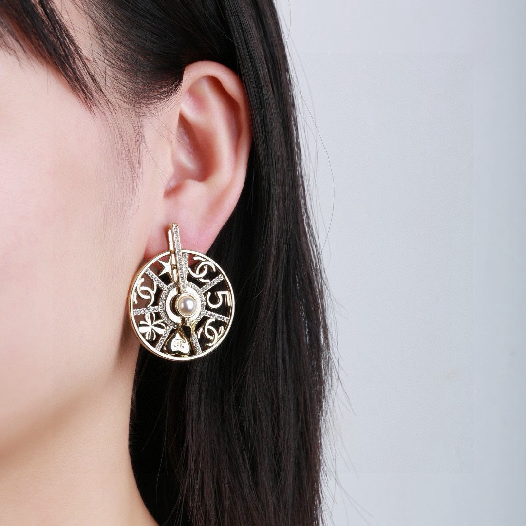 Martin Graham earrings in polished metal-tone – front product view