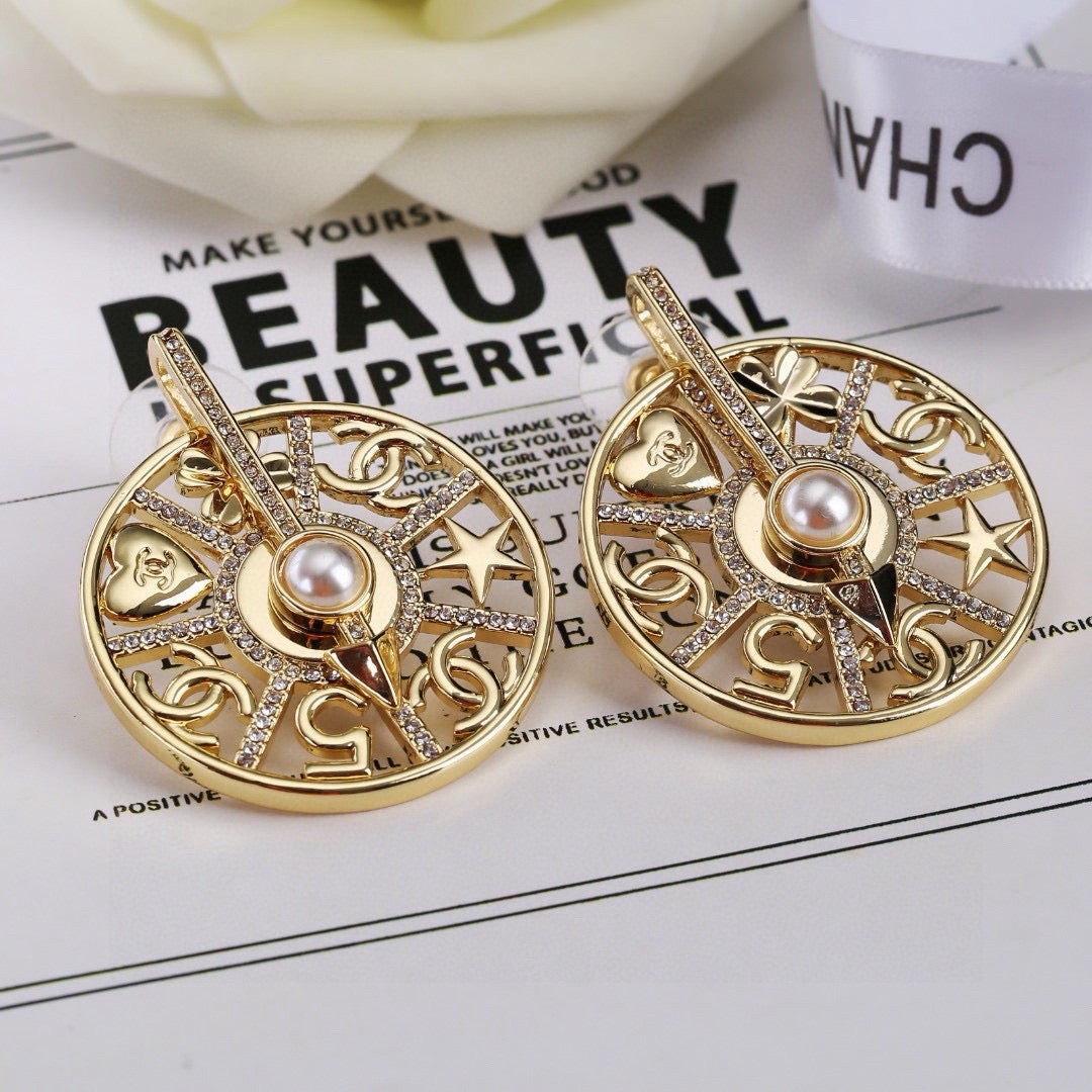 Martin Graham earrings in polished metal-tone – front product view